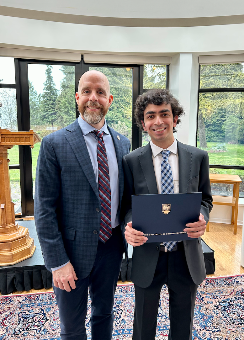 UBC President and Nicholas Viegas, who is holding a certificate